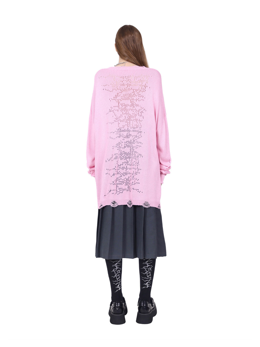 PINKSPINK ELECTRIC MOON distressed open-knit sweater in pink — full-length rear view styled over a pleated skirt