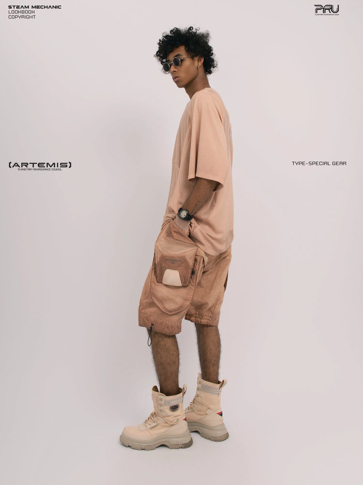STARFIELD WELDER soft dawn orange distressed mesh tee — full-length side view with one hand in a pocket