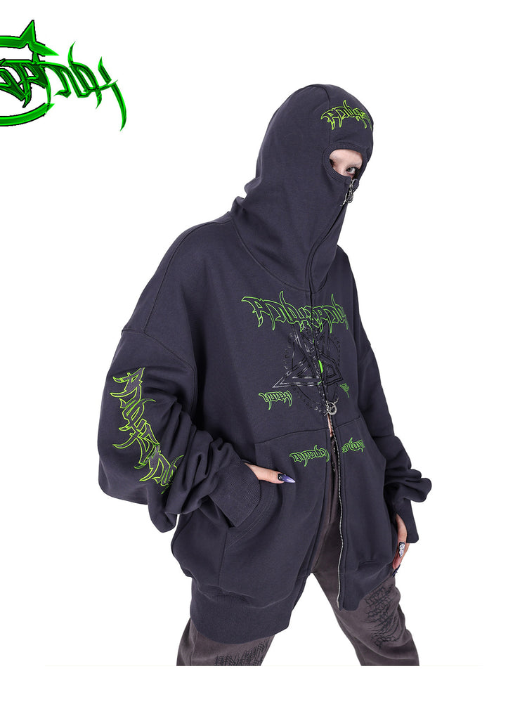 PINKSPINK DNA circle-star balaclava zip hoodie — angled modeled close-up showing the eye opening and green embroidery