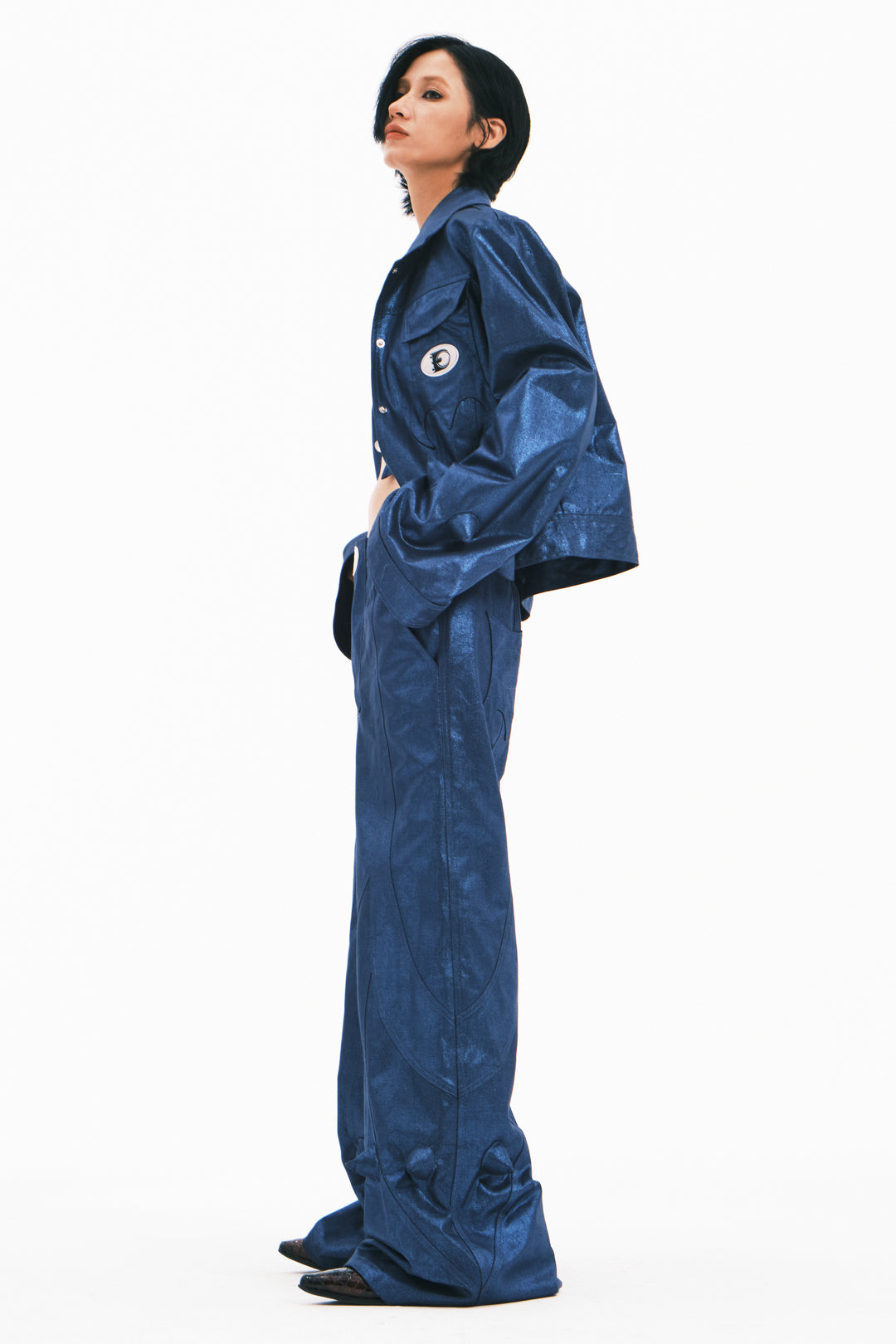 EMBRYO BLUE SPIKE metallic bell-sleeve jacket — blue side modeled view showing jacket length and pointed cuff