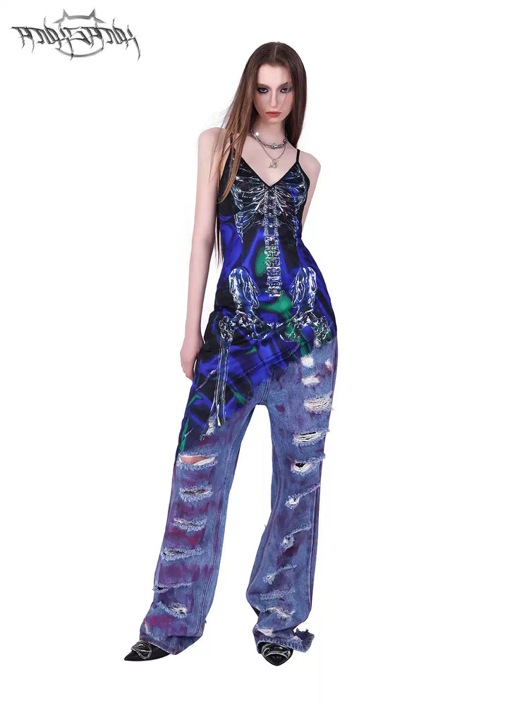 PINKSPINK WASTELAND pink-coated blue jeans — front angled styling view beneath an asymmetric blue-and-green dress