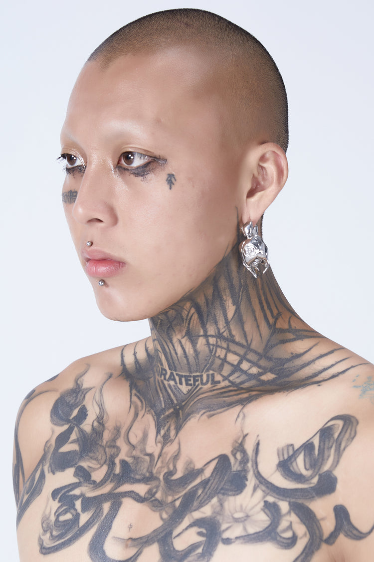 EMBRYO VENOM CLAW sculptural earrings — rear modeled view