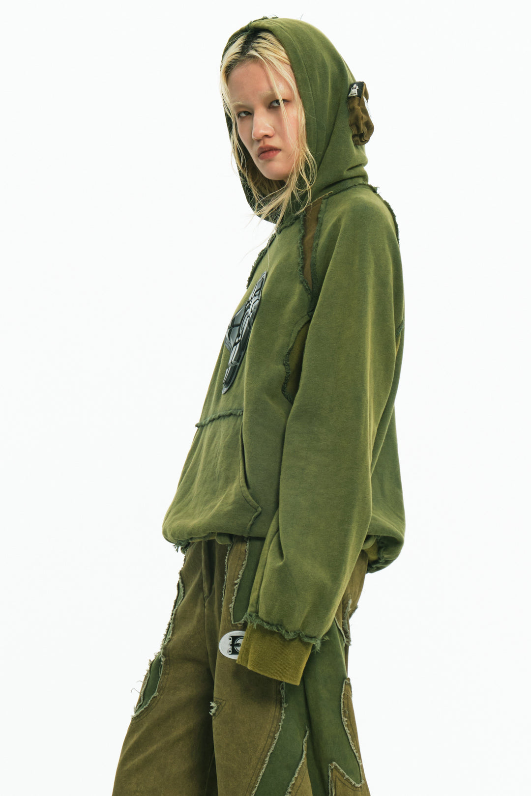 EMBRYO GREEN GUARD distressed armor hoodie — close modeled view
