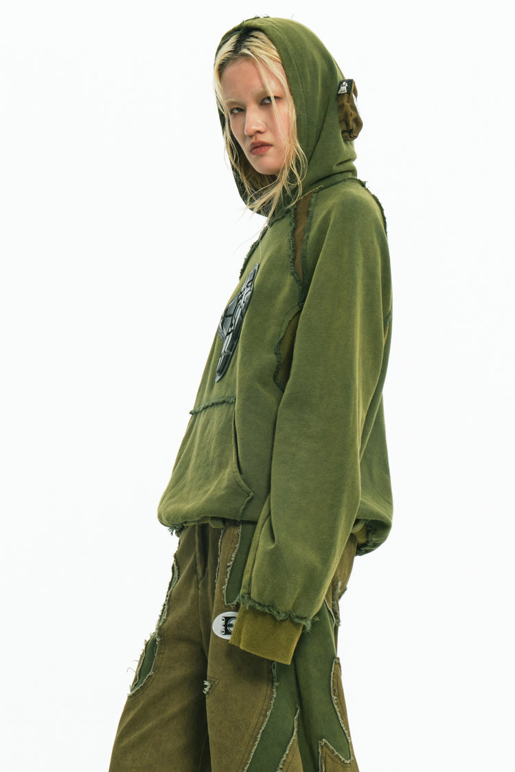 EMBRYO GREEN GUARD distressed armor hoodie — close modeled view
