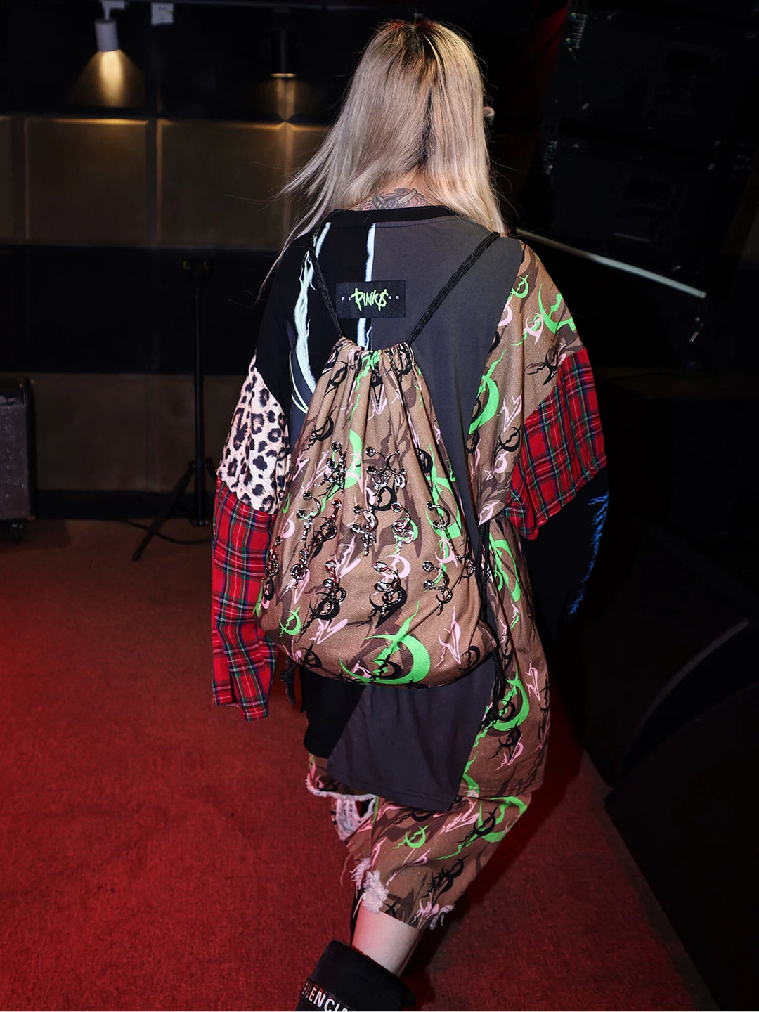 PINKSPINK ELECTRIC MOON camouflage charm drawstring backpack — brown camouflage — rear modeled view showing the metal charms