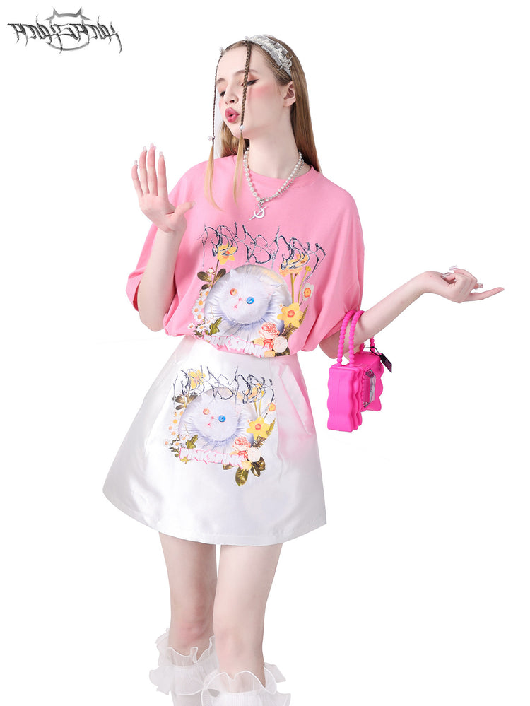 PINKSPINK GARFIELD oversized graphic tee — pink upper-body modeled view with one hand raised