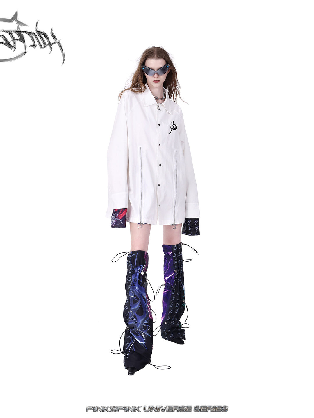 PINKSPINK COSMOS drawcord patchwork leg warmers in black purple multicolor — walking-pose modeled view styled with a white coat