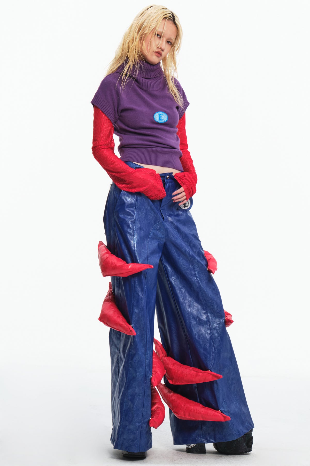 EMBRYO RED CLAW convertible padded PU pants — material and hardware detail