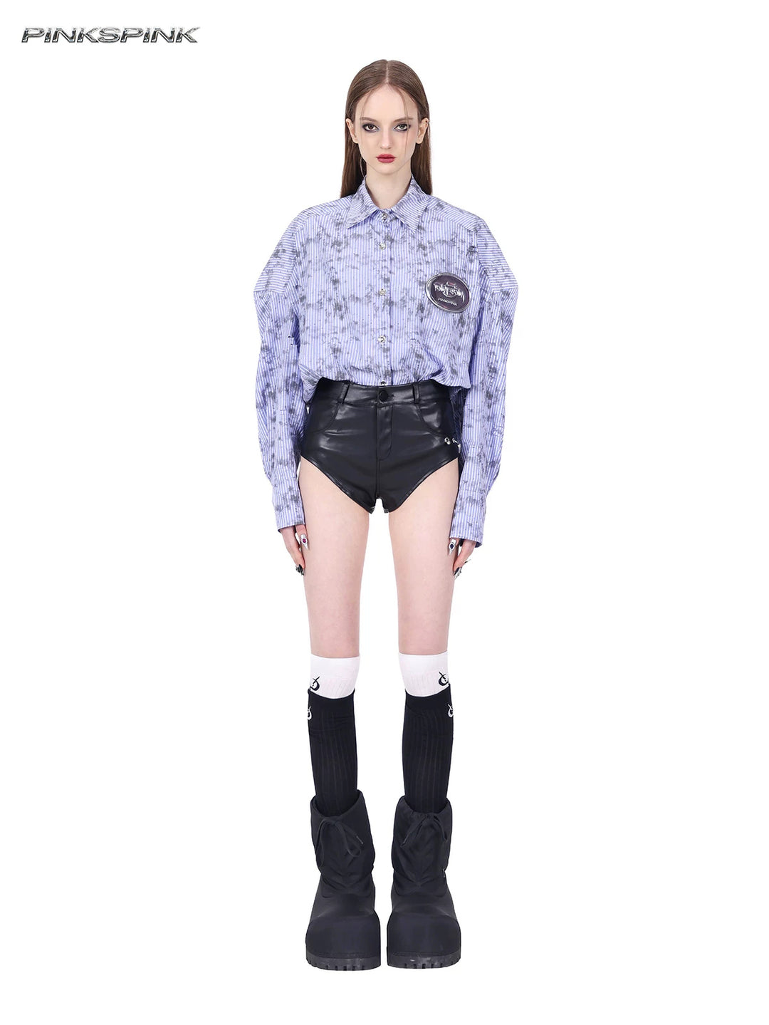 PINKSPINK REBEL ring-pierced faux-leather hotpants in black — full front modeled view with silver-tone piercing rings at the hip
