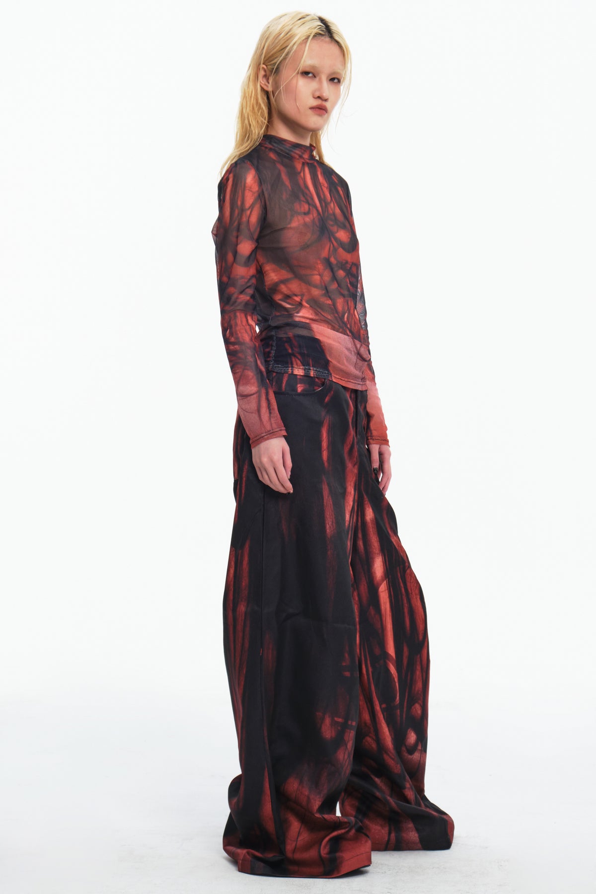 EMBRYO NERVE BLOOM printed flare pants — rear modeled view