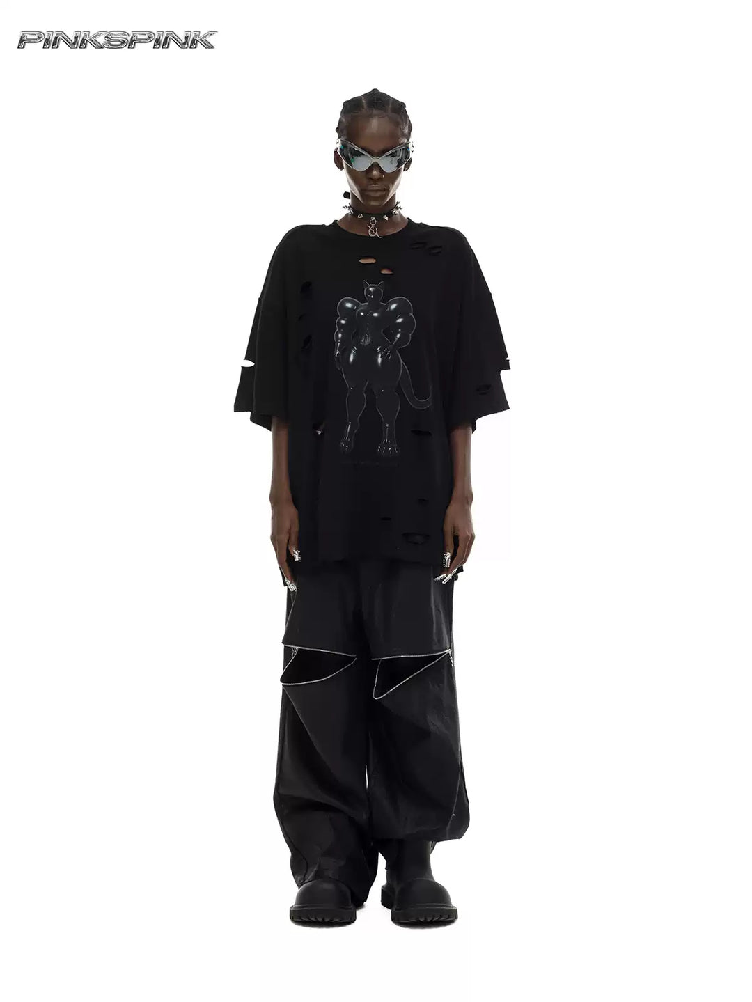 PINKSPINK ELECTRIC MOON coated zip-knee wide-leg pants in black — front full-length modeled view styled with a graphic tee