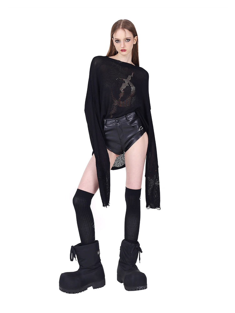 PINKSPINK ELECTRIC MOON distressed open-knit sweater in black — angled full-length view with sleeves extended below the hands