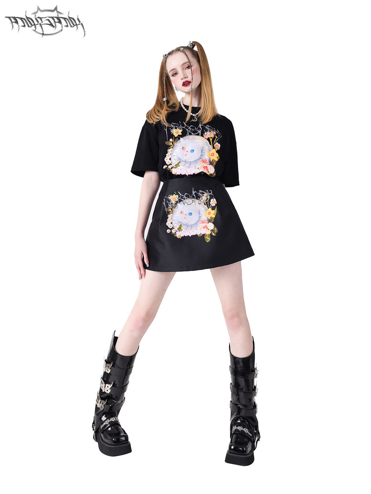 PINKSPINK GARFIELD graphic mini skirt — black full-length modeled view with the matching tee and a wide stance