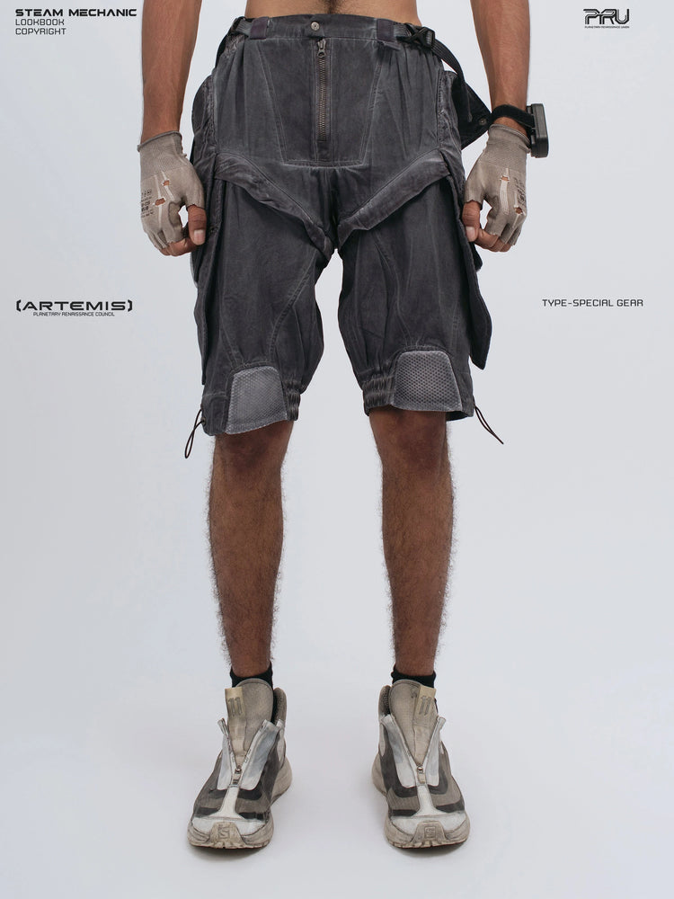 ARTEMIS stellar blue detachable technical shorts — front modeled view with closed hands at the sides