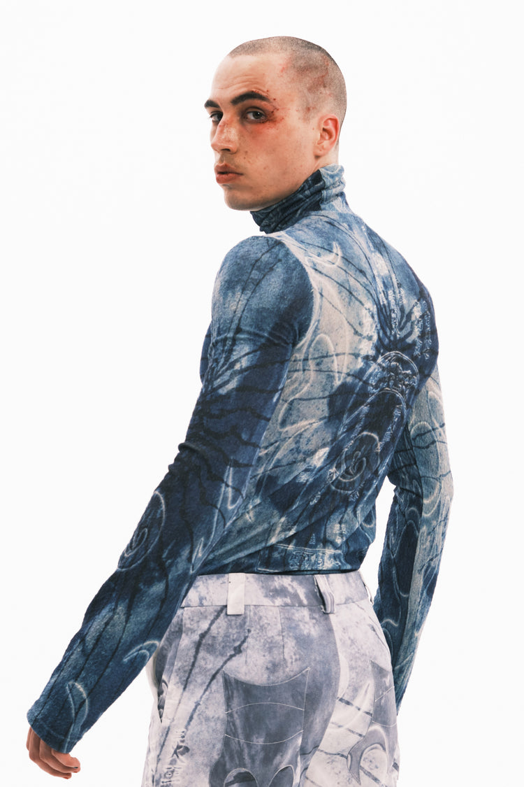EMBRYO ANCIENT CODE textured mock-neck top — close modeled styling view