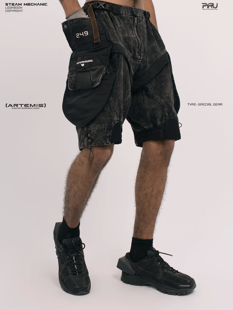 ARTEMIS blackbird black detachable technical shorts — side view with hand in cargo pocket