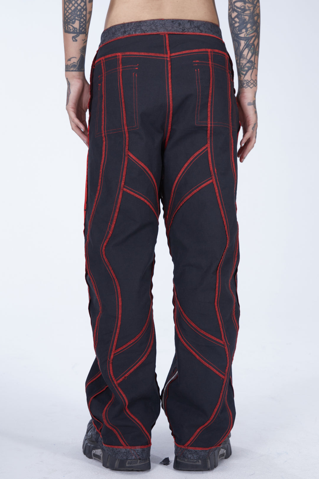 EMBRYO STRUCTURE convertible bustier & wide-leg pants — black reverse trouser configuration, straight rear view with red seams