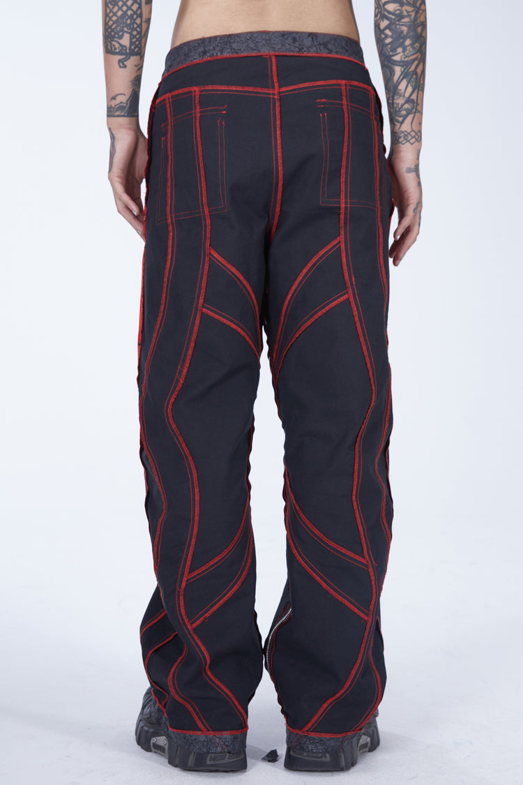EMBRYO STRUCTURE convertible bustier & wide-leg pants — black reverse trouser configuration, straight rear view with red seams