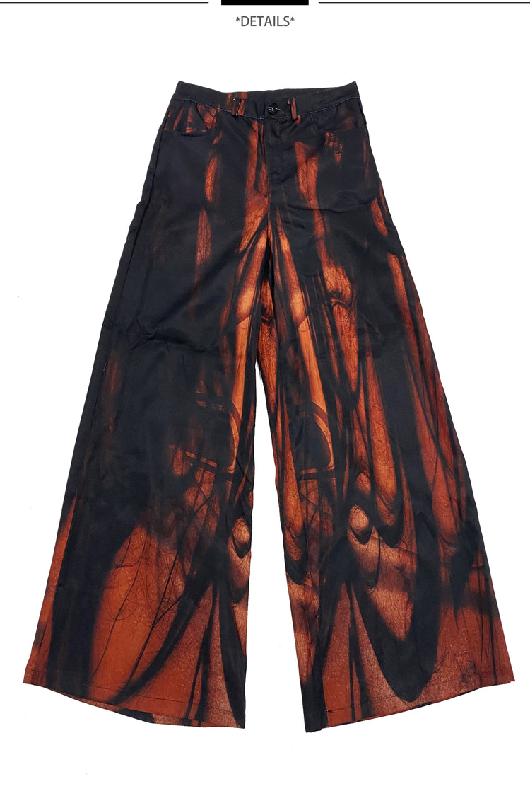 EMBRYO NERVE BLOOM printed flare pants — full-length modeled view
