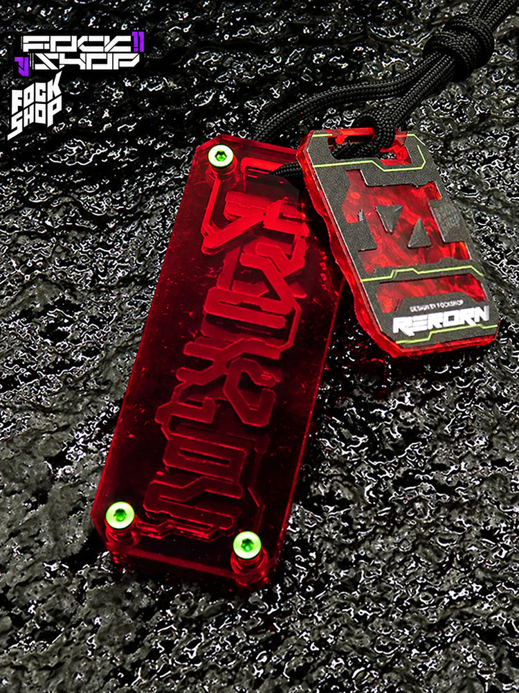 FOCKSHOP REBORN talisman charm — RED CLEAR front view showing the transparent layered body and cord