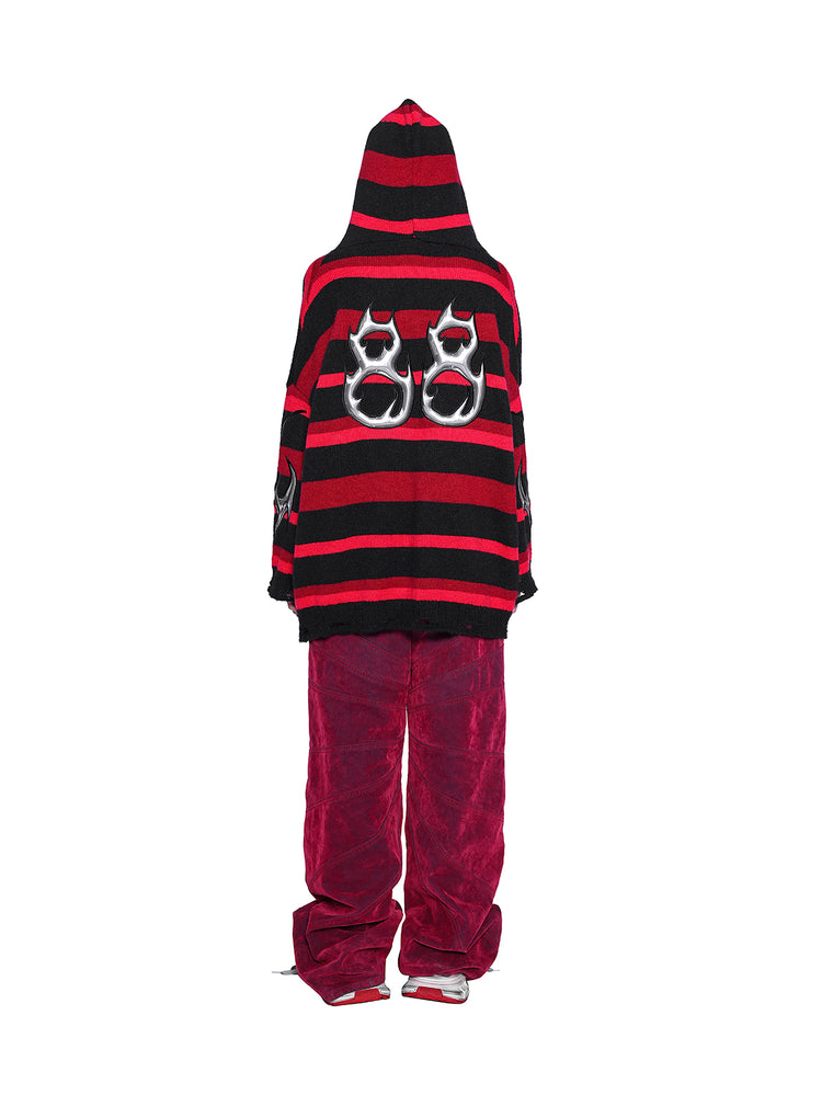PINKSPINK ELECTRIC MOON striped hooded sweater in BLACK AND RED — full-body back view styled with red trousers.