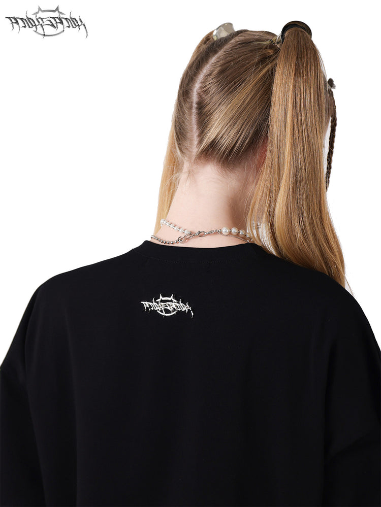 PINKSPINK GARFIELD oversized graphic tee — black rear neckline close-up showing the brand patch