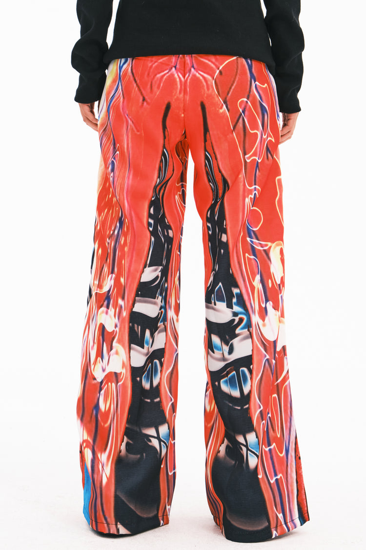 EMBRYO NEURAL FIRE printed flare pants — rear modeled view