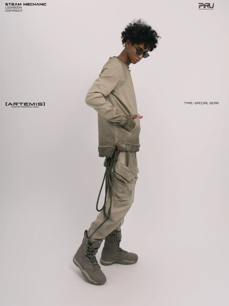 CHAOS ERA xirang brown raw-edge long-sleeve top — full-length side view with hand in pocket