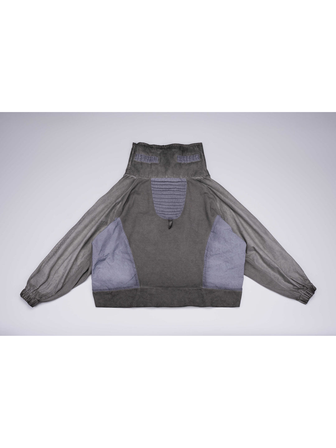 PIONEER moon dust gray detachable-pocket utility hoodie — back flat-lay view showing the pleated contrast panel and long back hem