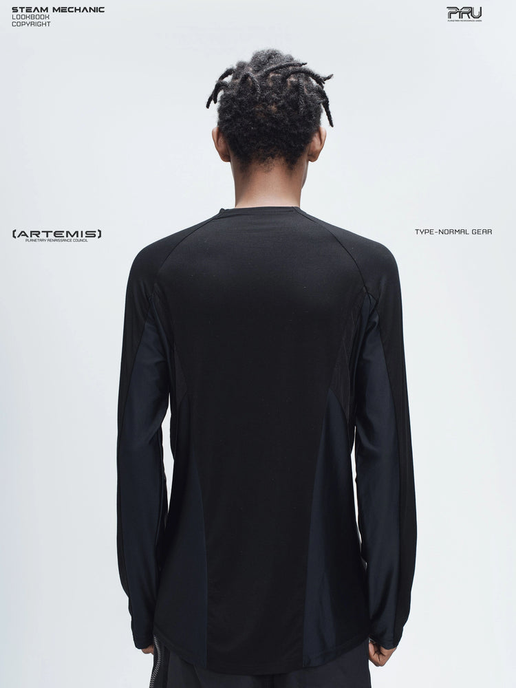 ARTEMIS stardust black stretch technical base-layer top — back modeled view showing the raglan seams and straight hem