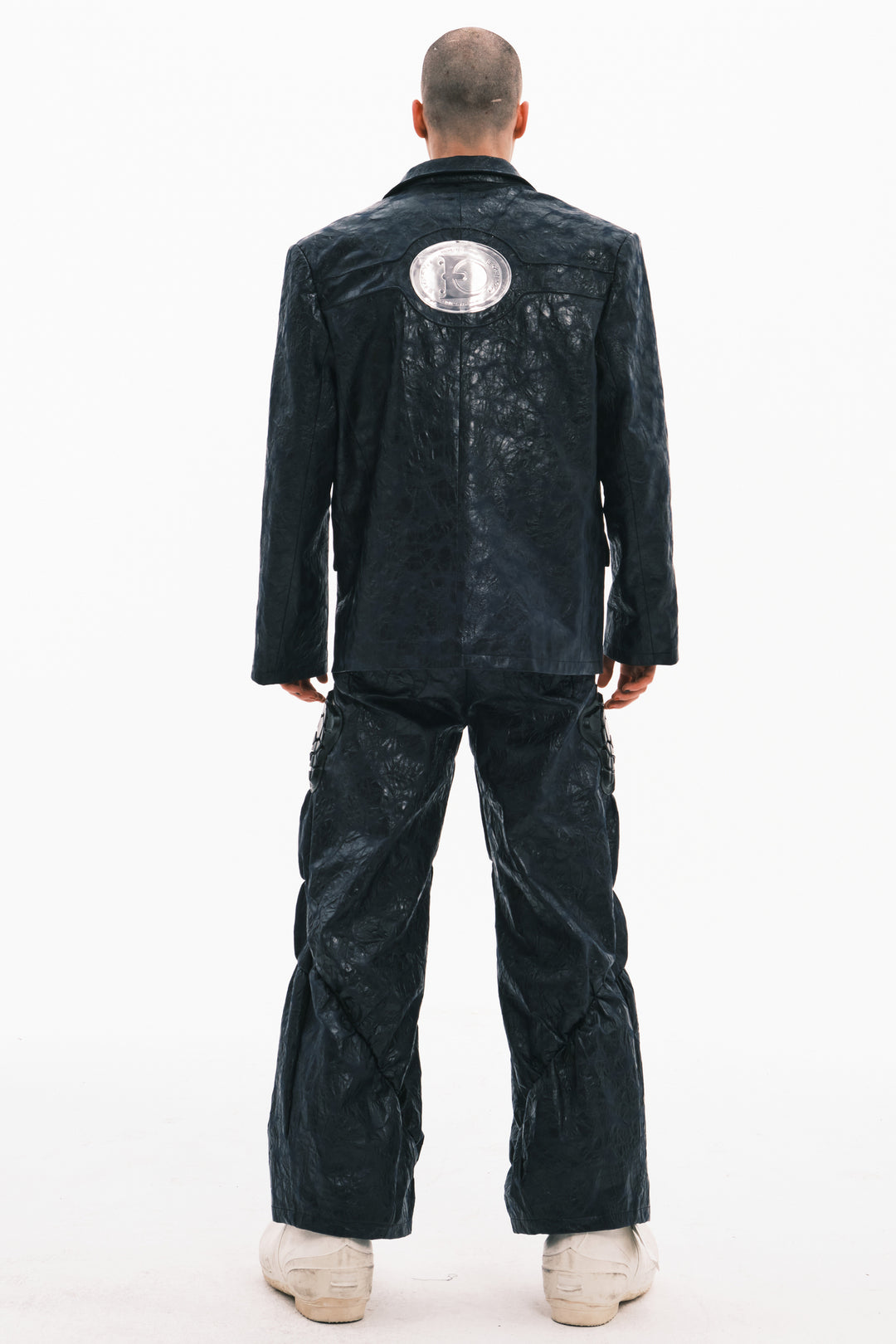 EMBRYO HORN CODE textured PU leather blazer — material and hardware detail