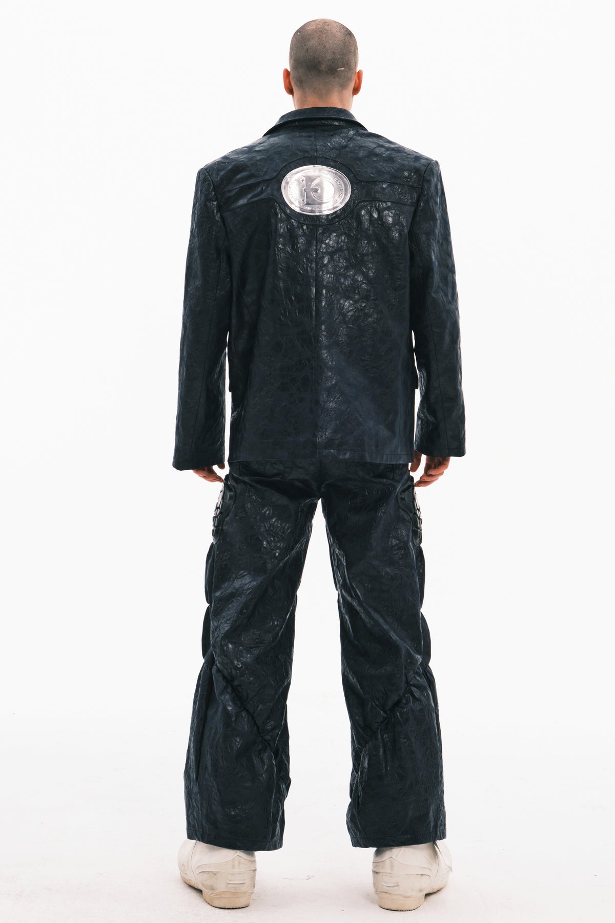 EMBRYO HORN CODE textured PU leather blazer — material and hardware detail