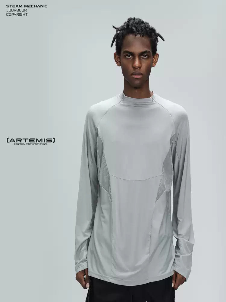 ARTEMIS moon dust gray stretch technical base-layer top — close front modeled gallery view of the curved panel construction