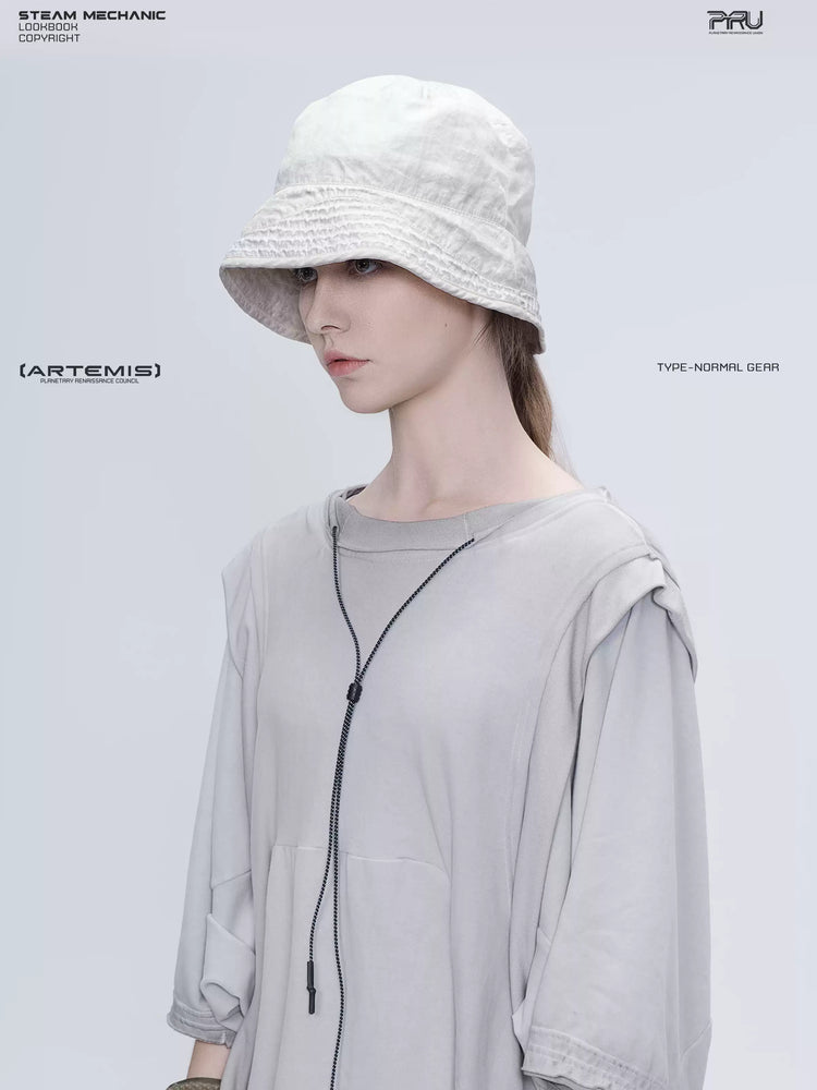 PIONEER eris white distressed nylon bucket hat — left-facing close-up showing the weathered nylon texture