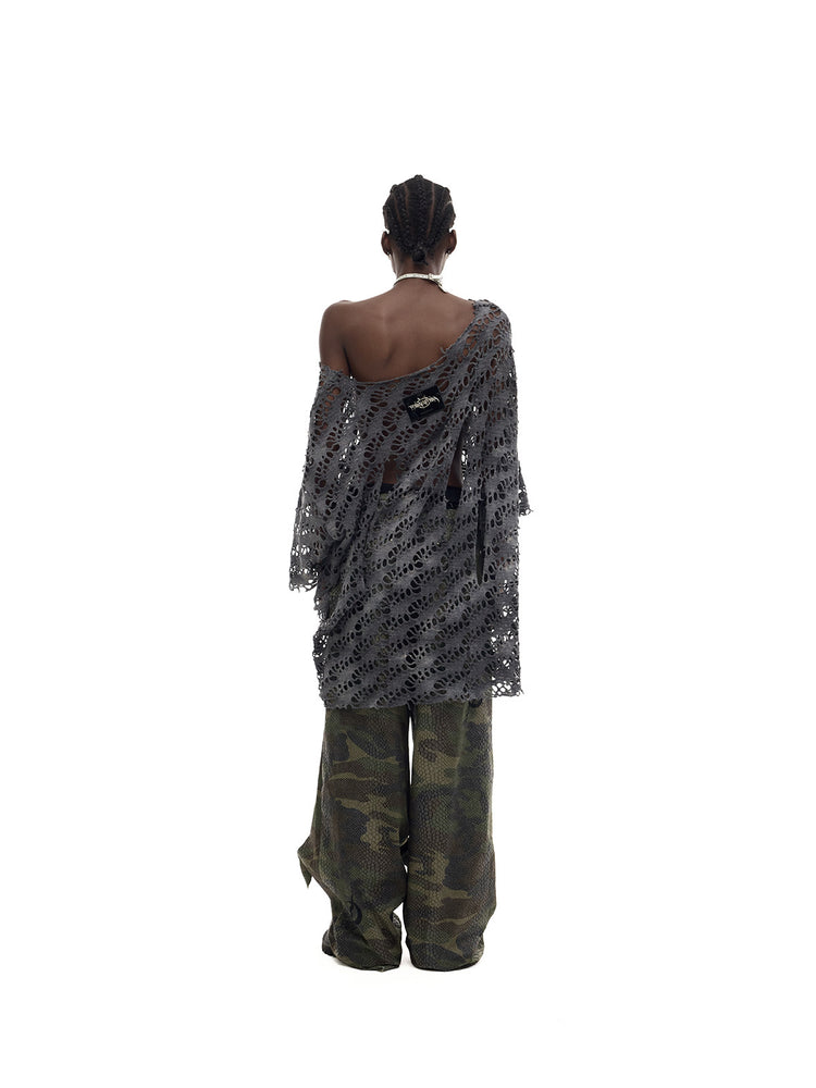 PINKSPINK ELECTRIC MOON distressed open-knit oversized tee in charcoal gray — full-length back modeled view with camouflage trousers