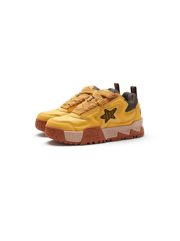 STARTER PUFF Desert Yellow pair in a clean three-quarter studio view, showing padded star panels, broad laces and sculpted platforms