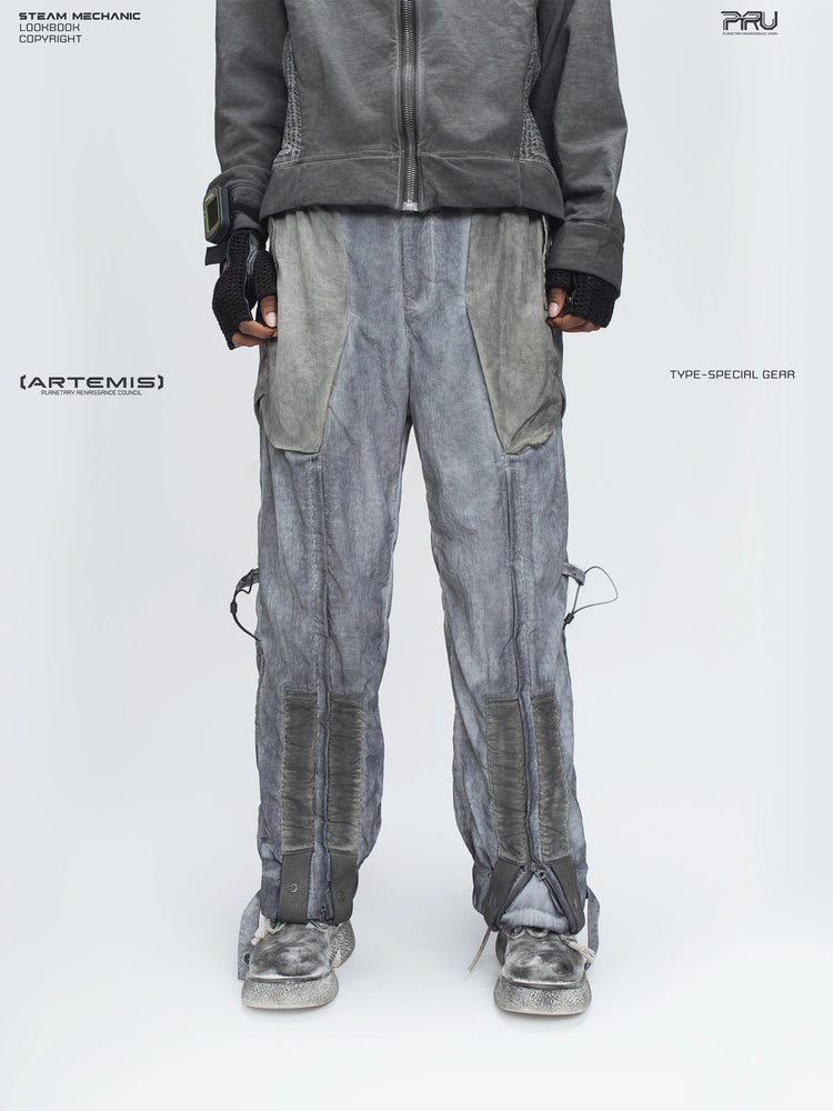STARCORE moon dust gray engineer utility pants — front lower-body modeled view with the leg zippers closed