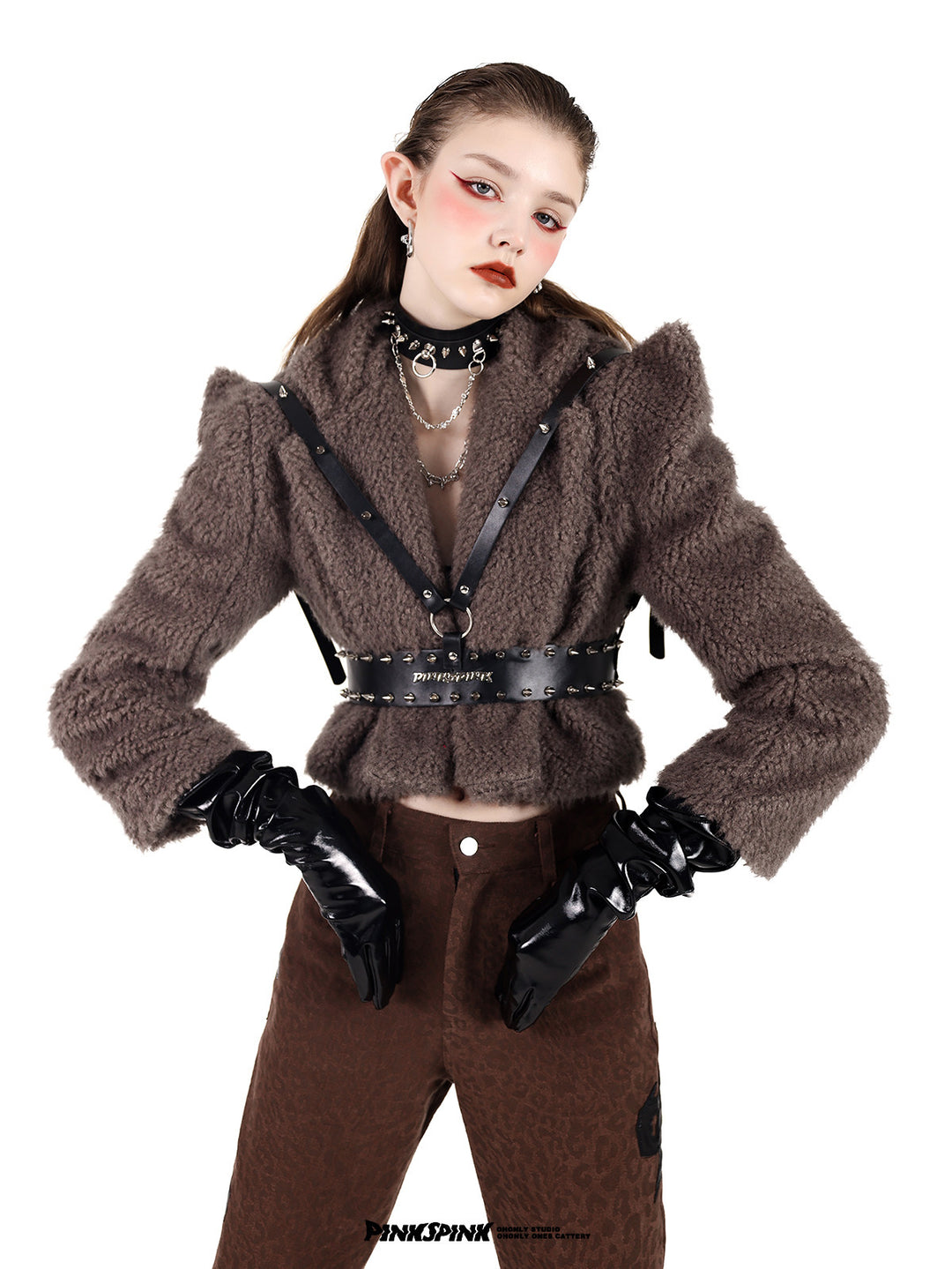 PINKSPINK SPIKE RING studded chain choker in black — front modeled close-up with hands on hips and a studded harness