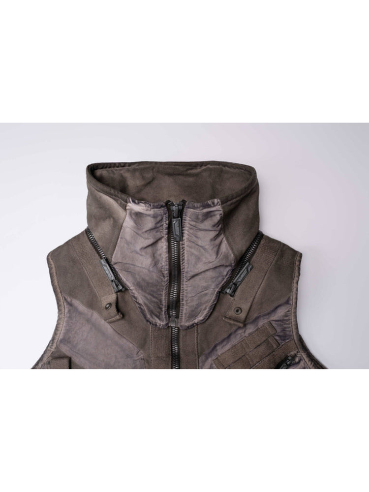 FISSION modular vest — close-up of the raised collar and detachable shoulder zippers