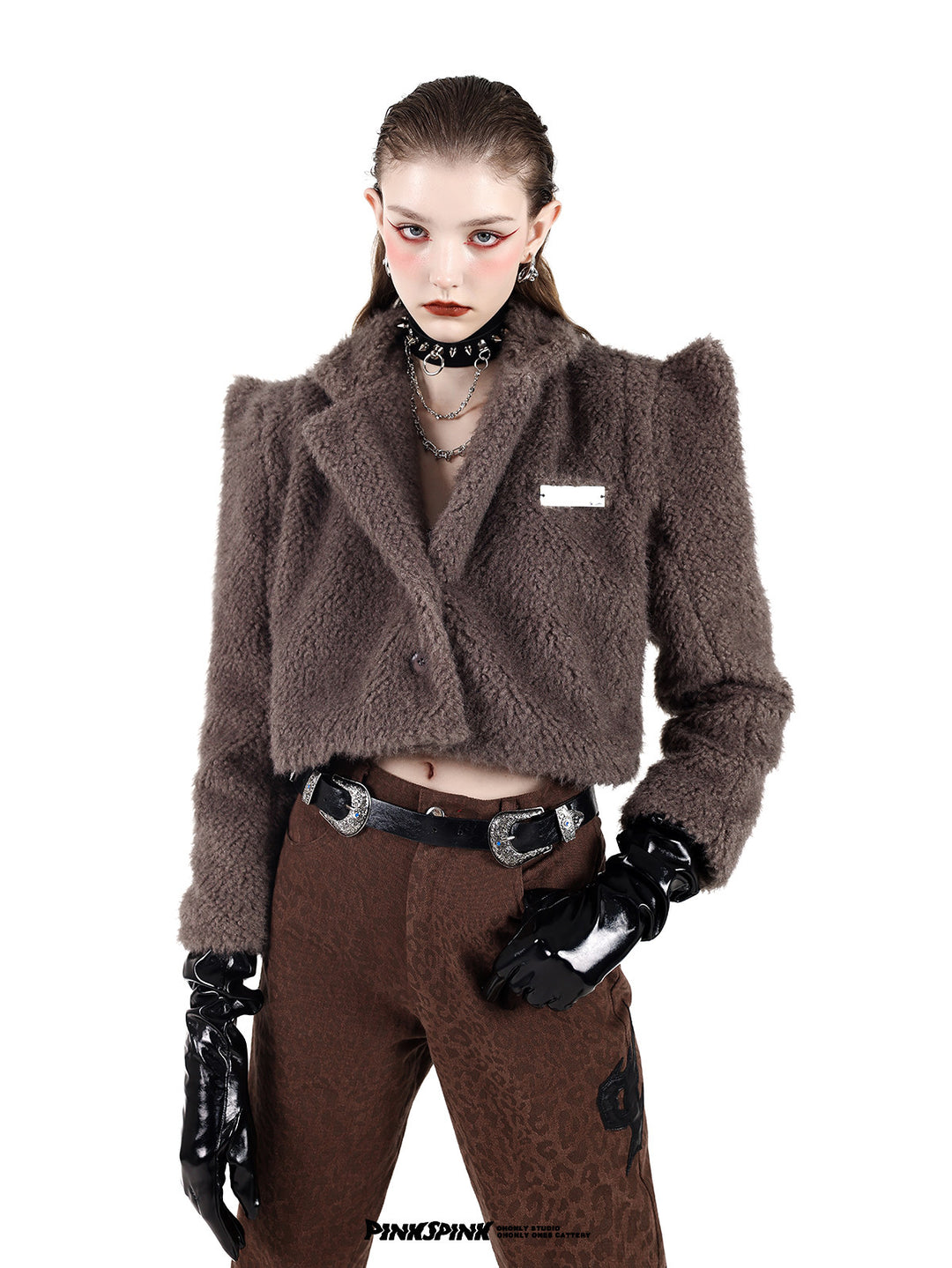PINKSPINK SPIKE RING studded chain choker in black — front modeled close-up with a brown pointed-shoulder jacket