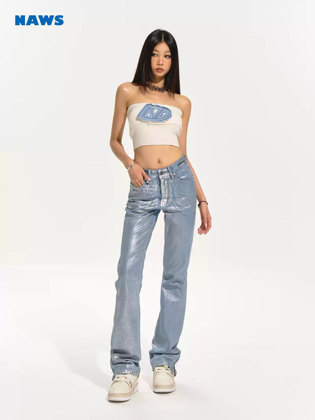 NAWS wax-coated zip-hem jeans in GLACIER LAKE BLUE — full modeled front view showing the metallic blue coating.