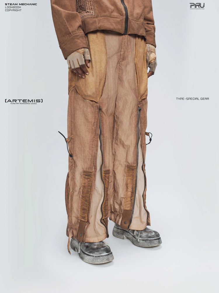 STARCORE venus orange engineer utility pants — three-quarter front modeled view with the leg zippers open