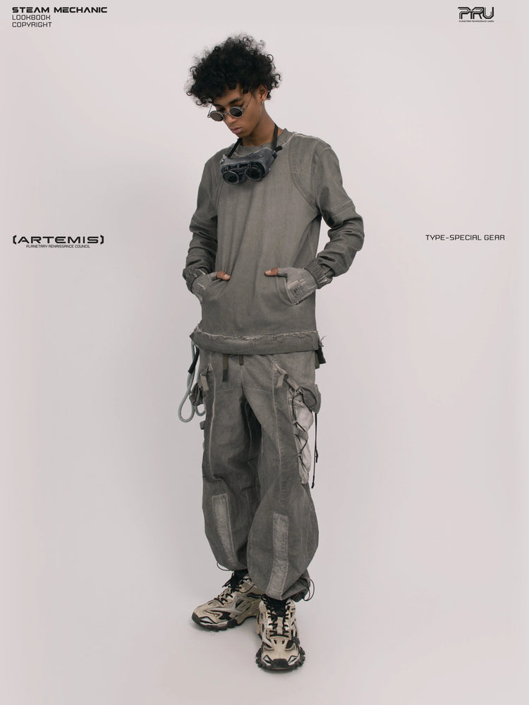 CHAOS ERA moon dust gray raw-edge long-sleeve top — full-length front view with hands in pockets