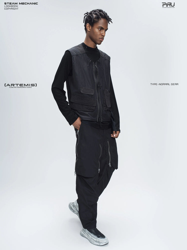 ARTEMIS stardust black stretch technical base-layer top — three-quarter full-length styling view with a separate utility vest