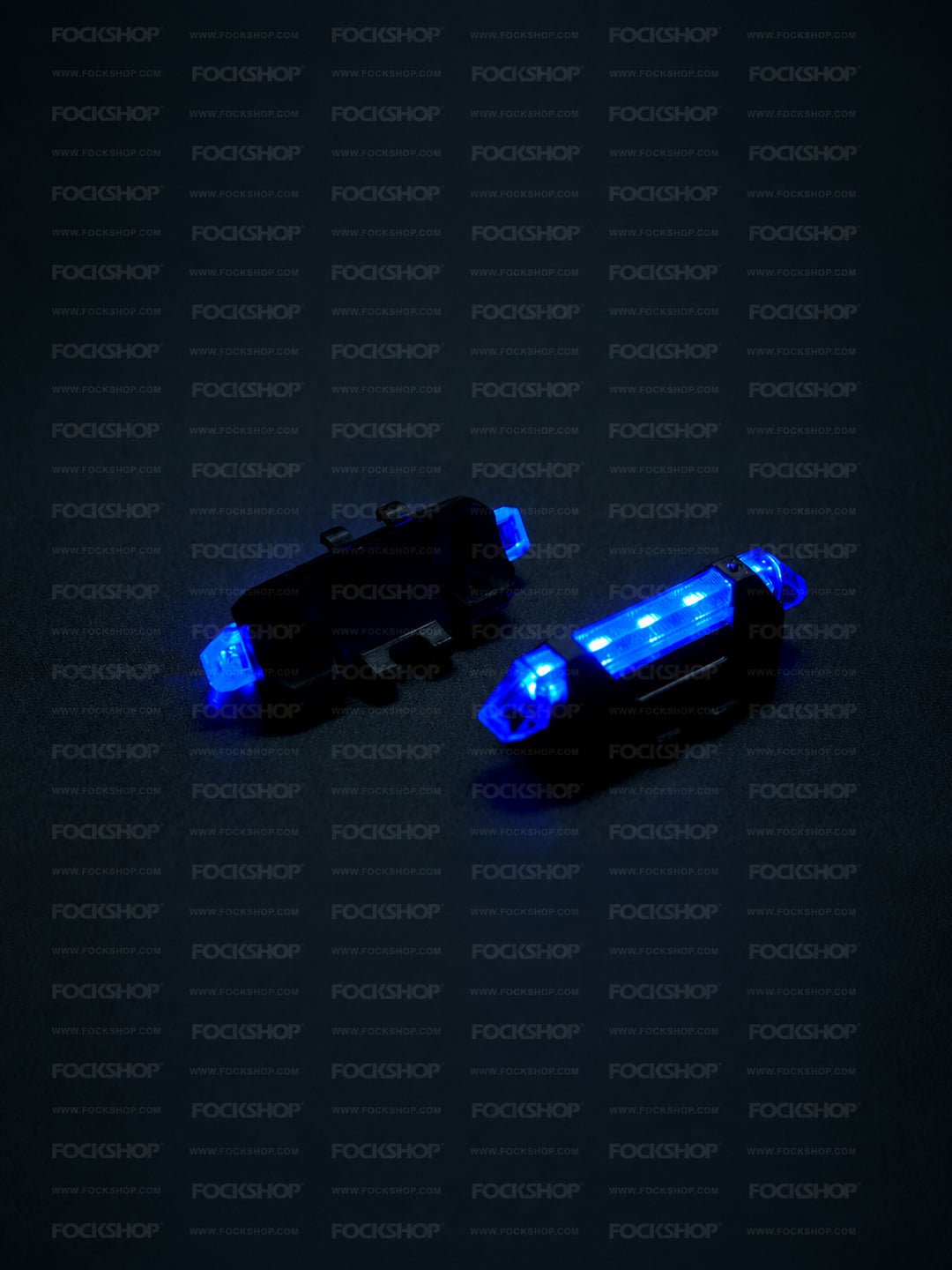 FOCKSHOP TRAIN L rechargeable costume light pair — blue lights showing the illuminated front and mounting back