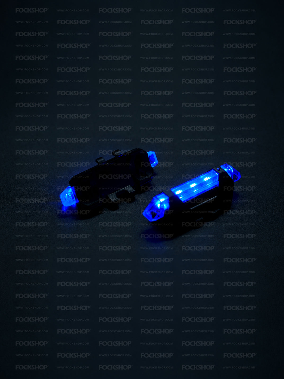 FOCKSHOP TRAIN L rechargeable costume light pair — blue lights showing the illuminated front and mounting back