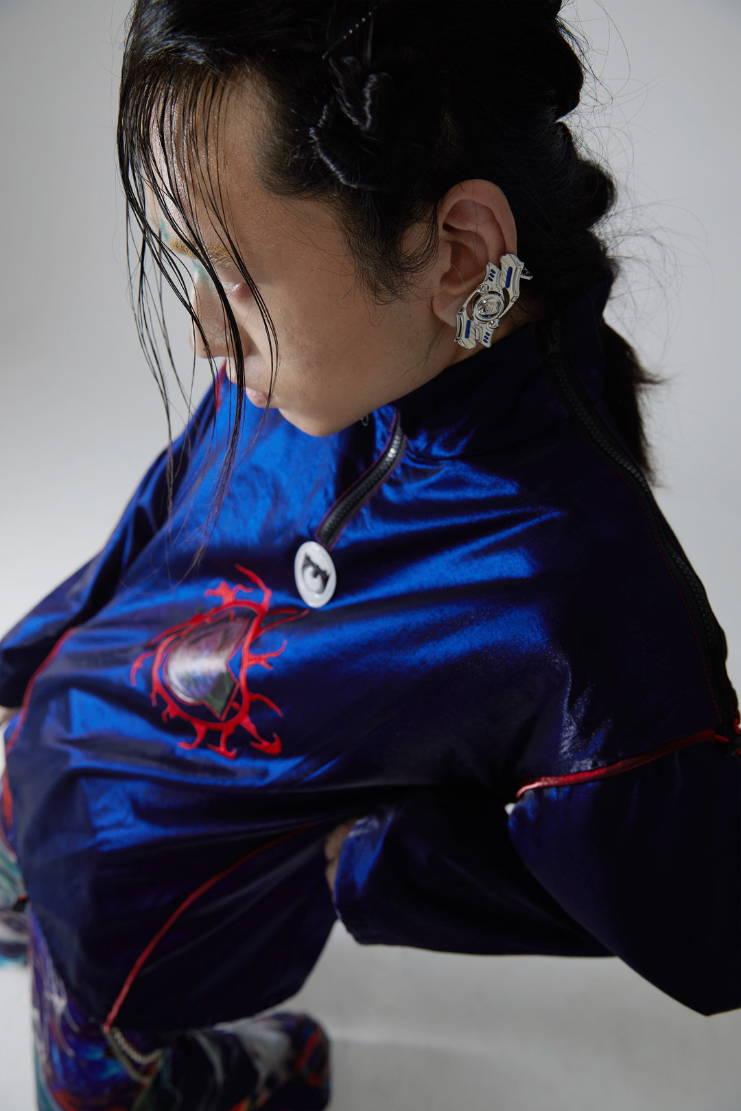 EMBRYO CURSE rotating cyber earrings — rear fastening view