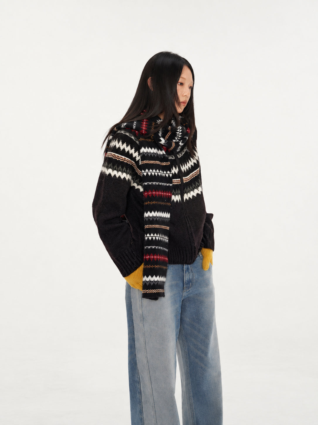 NAWS FAIR ISLE wool-alpaca cardigan in black — side modeled view showing the Fair Isle yoke and long scarf