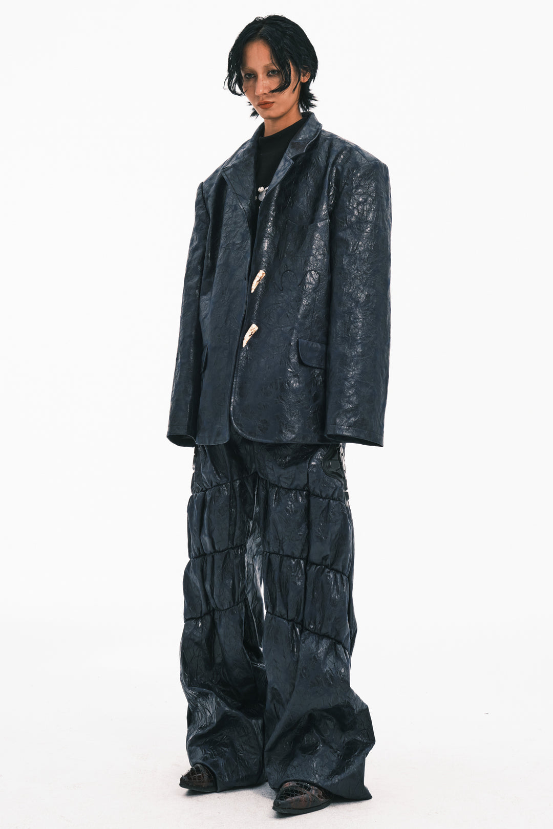 EMBRYO HORN CODE textured PU leather blazer — construction and silhouette detail