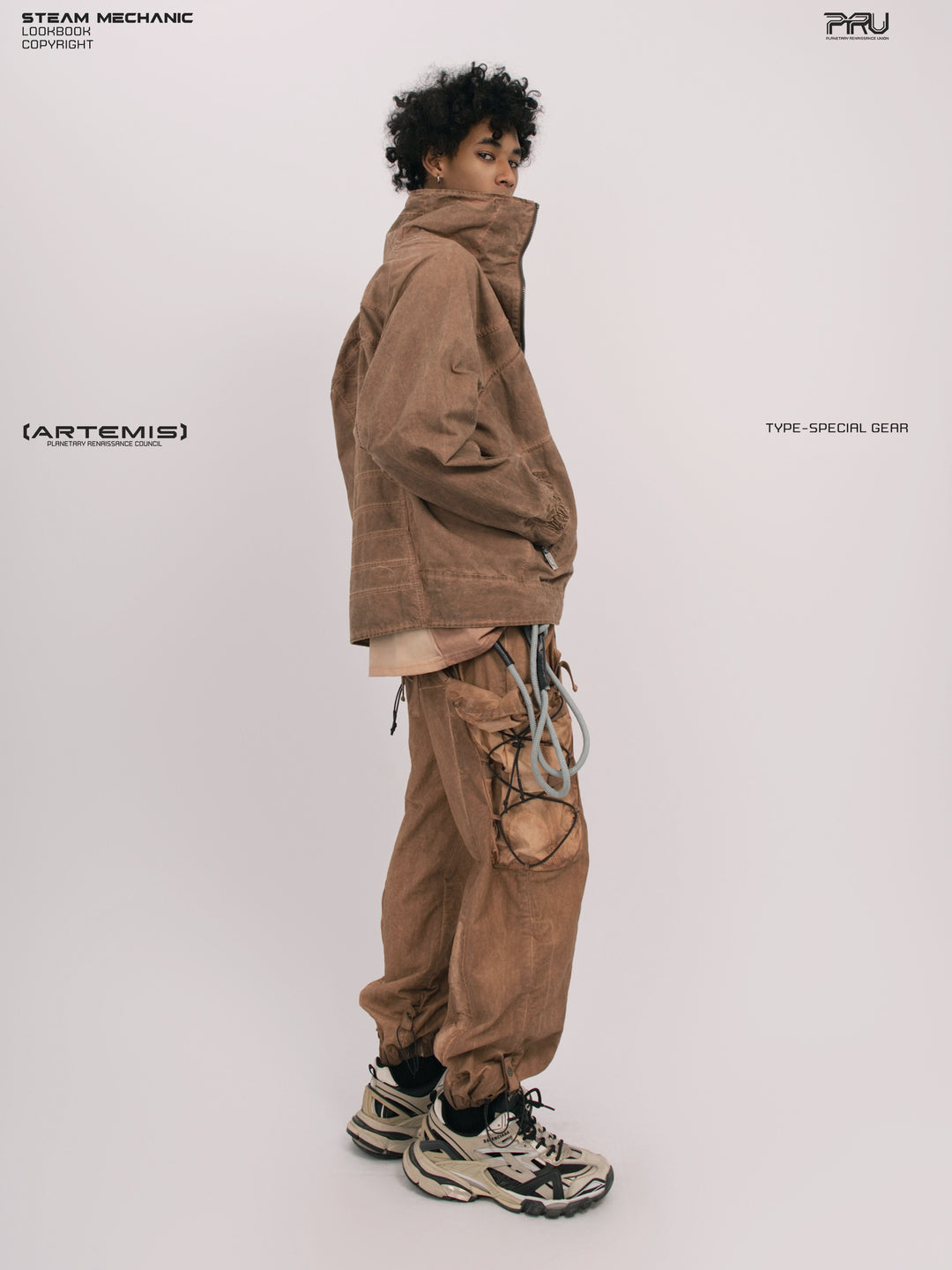 ARTEMIS soft dawn orange tuck-paneled technical jacket — full-length side modeled view showing raised collar